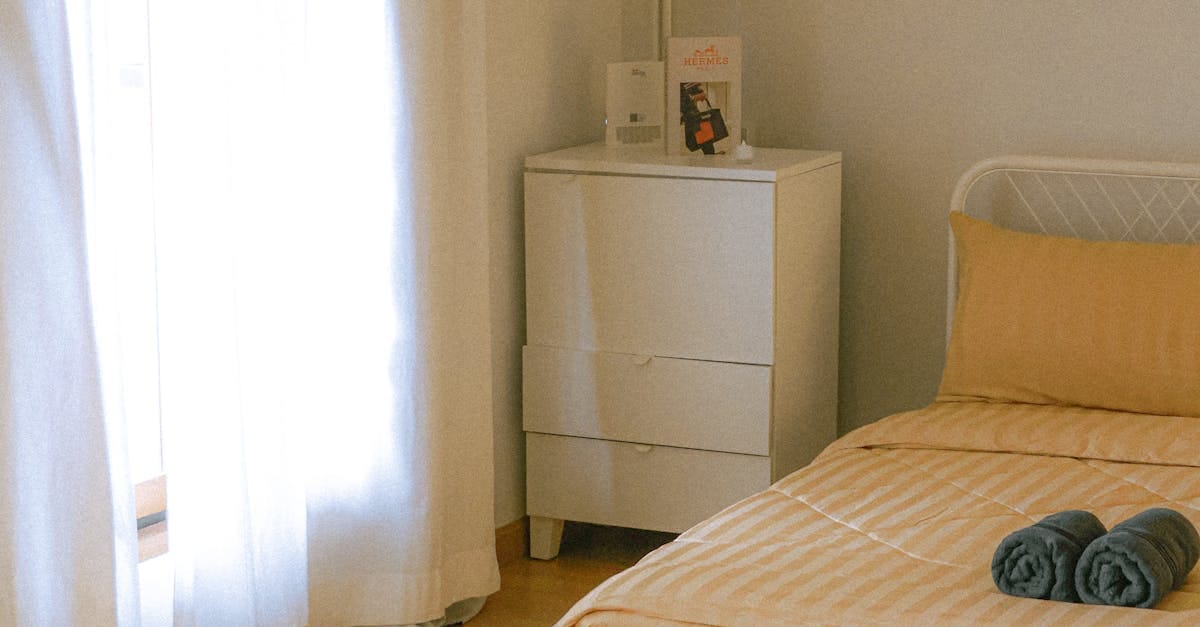 Bright minimalist bedroom interior with natural lighting in Bangkok, Thailand.